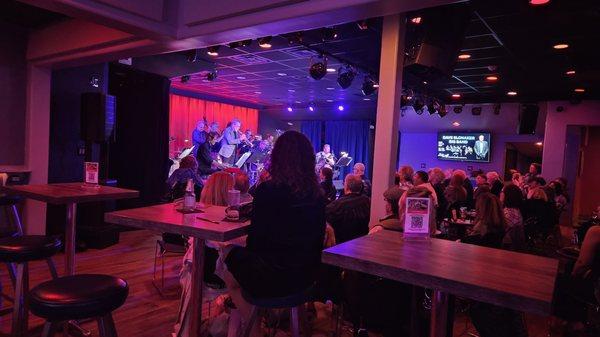 You have a big band ensemble and everyone looks like they're watching a play.  Great space, just needs to be turned into a true music venue.