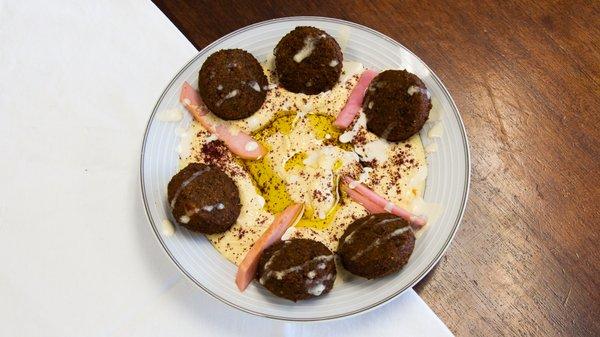 Falafel plate  Falafel with Hummus and served with side dish of fresh made salad.