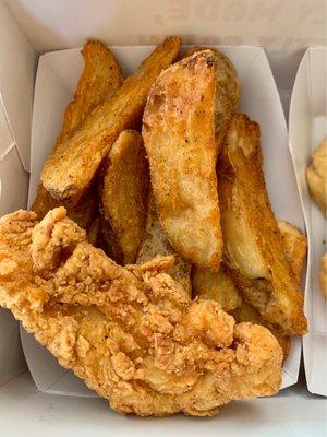 Wedge fries plus one Cajun tender.