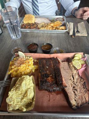 Street corn , potato salad , Ribs and Brisket