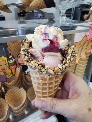 Strawberry Banana and Strawberry ice cream in a waffle cone.