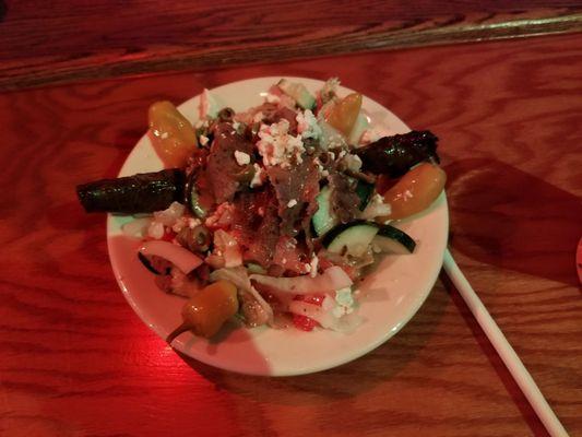 The Greek Salad with Gyro meat and grape leaf's.