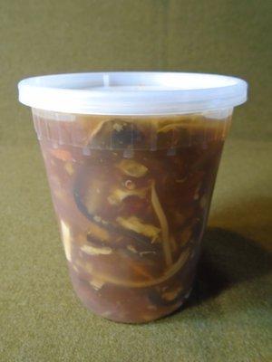 A BIG hot sour soup in my to-go container.