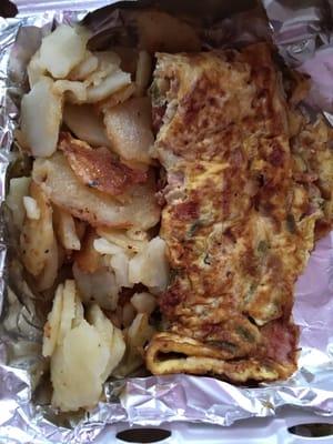 Western omelette(ham,onions,peppers) w/ home fries.also comes w/ a piece of toast (not pictured)