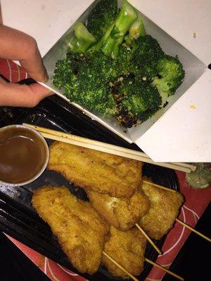 Chicken Satay, side of garlic stir fry broccoli