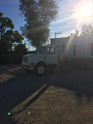 Dumpster Delivery Truck