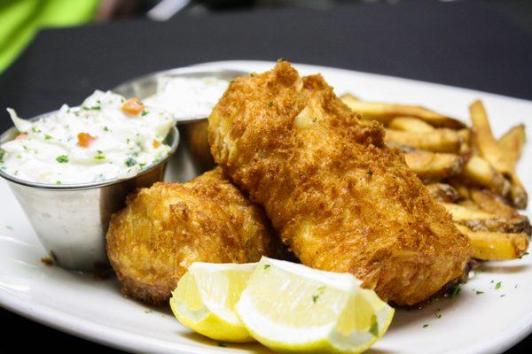 A Wisconsin Supper Club tradition--Fish n' Chips! Beer battered cod loins, house cut fries, coleslaw, tartar, and fresh lemon.