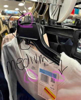 Medium short hung on Small labeled hanger- tons of this all over store.