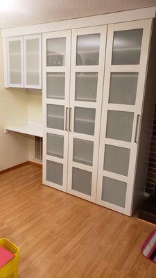 frosted glass doors on home office desk.