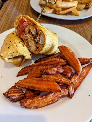 Buffalo Chicken tender wrap with sweet potato fries. The perfect "medium", but a bit heavy on the tomato.