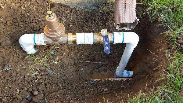 Installation of a water pressure regulator to protect irrigation system and a emergency shut-off valve.