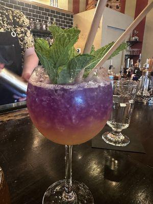 Handsomest Woman in the World - butterfly pea flower Strongwoman Gin, lime, passion fruit, mint, and basil & so beautiful