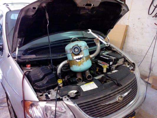 Muffler Minion services another happy Chrysler van!