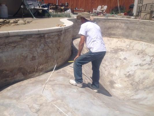 Measuring a pool for a new vinyl liner.