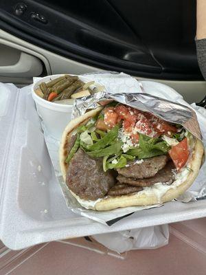 Beef and lamb gyro sandwich on pita bread.