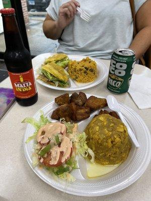 Pork Jibaritto with arroz con gandules  (rice&pigeon peas). And mogón go y carne frita (Green plantin loaf  and fried pork and salad.