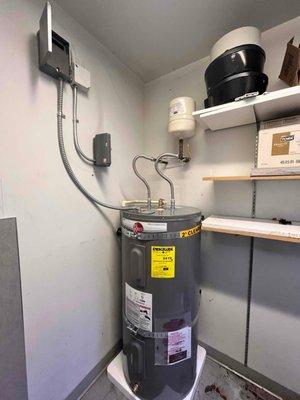 Rheem 50-gal water heater installed in a car dealership