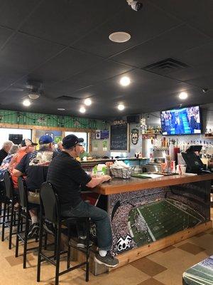 Everybody hanging at the bar with their morning coffee