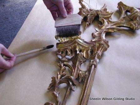 24 karat gold leaf is layed on a carved wood frame.