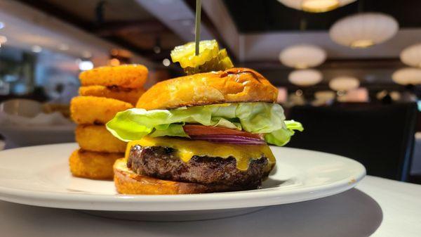 Cheeseburger with onion ring side.