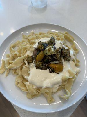 Handmade pasta with Alfredo sauce and roasted vegetables