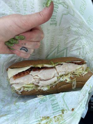 Customized turkey sub with lettuce, onion, pickle, mayo, mustard, thunder sauce, bacon, avocado, and provolone