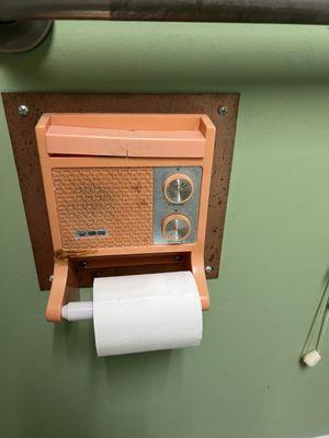 Radio toilet paper holder in the bathroom