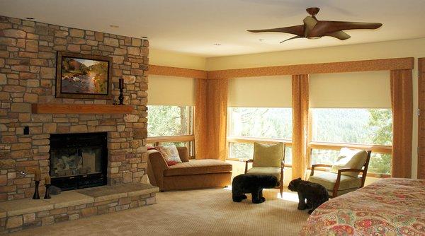 Master bedroom motorized roller shades with fabric valance draperies.