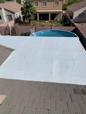 Phoenix roof after a new rolled roof was installed with elastomeric sealant