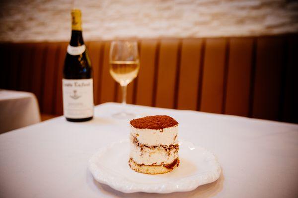 Tiramisu 
Delicate coffee-soaked ladyfinger cookies, stacked between rich mascarpone cream, with a hint of cocoa powder dusted on top.