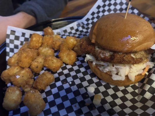 Spicy fried chicken sandwich with tater tots