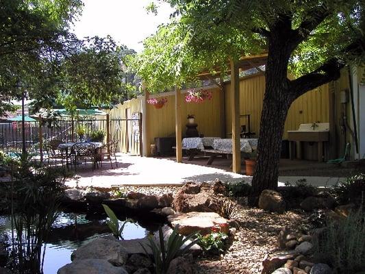 Relax on the patio by the pool to the sounds of the waterfall.