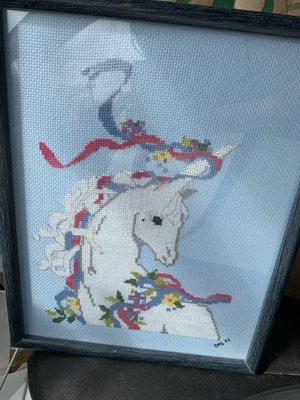 An amazing cross-stitched framed unicorn that has made my life infinitely better.