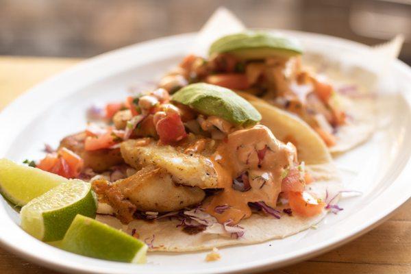 Baja Fish Taco:
Grilled or fried fish served in a flour tortilla with cabbage, pico de gallo, special sauce, and sliced avocado!