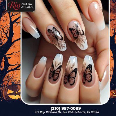 Embrace the magic of Halloween with spooky butterfly nails! A blend of elegance and mystery, perfect for the season.