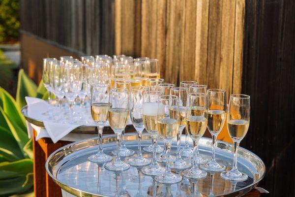 The wait staff prepared the champagne toast