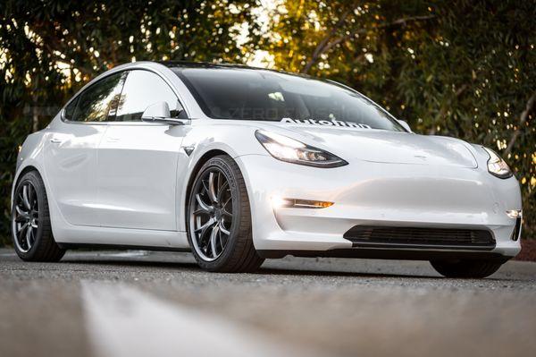 Model 3 on coilovers and 19" wheels.