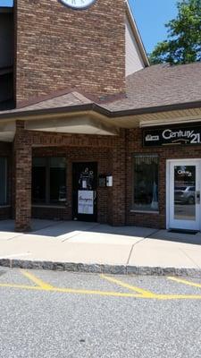 Front of building, located in the strip mall next to Century 21.