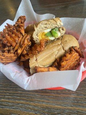 Cheese and veggie sandwich on wheat with sweet potato waffle fries