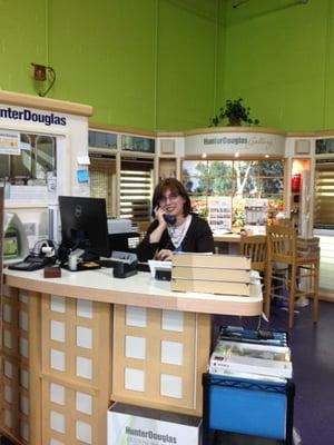 Chelsea in the Hunter Douglas Gallery, answering your phone call!