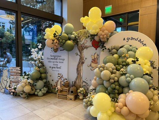 Baby Shower with Balloon Garlands and backdrops.