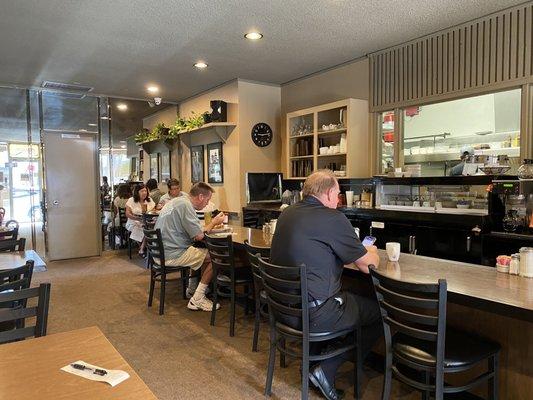 Counter space and the door leading to the gender-specific restrooms