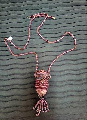 Beaded necklace with beaded pouch