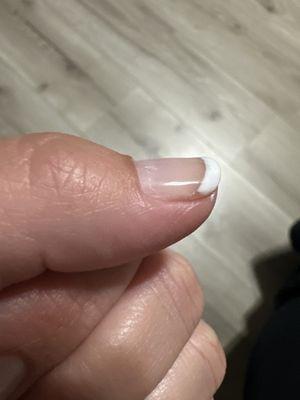 After the lady filing my nail, she didn't wipe off the dust and now it's imprinted on my gel nail!