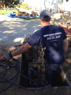 Pipe bursting 35 feet of old clay pipe to avoid a major excavation.