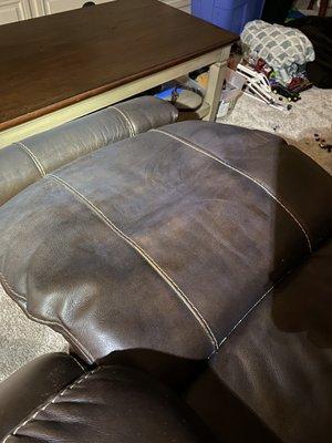 Paint dust on leather chair even after they cleaned it