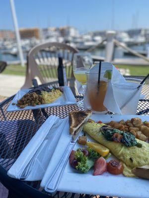 Steak and eggs and veggie omelet, side of grits and Amazing potatoes'