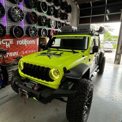 Neon Yellow Car Wrap, custom Lettering and sleek Window Tint by the best.