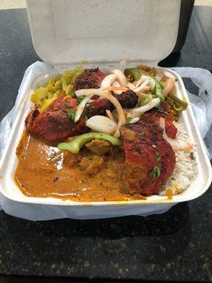 An example of how much a to-go container can be filled with (plus a side of Naan) for only $13