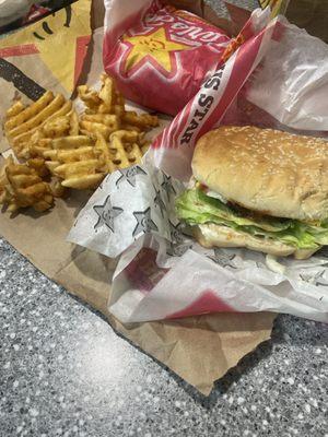 Famous star cheese burger and waffle fries